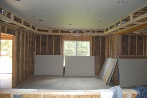 Opposite Of The Bar Insulated And Sheetrock Being Hung